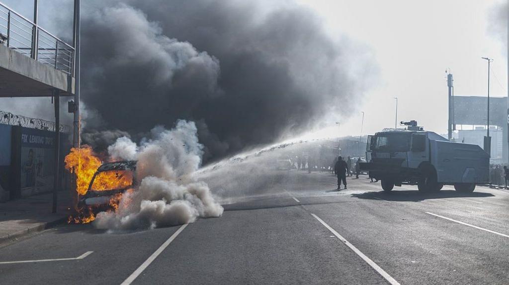 South African Protests Turn Violent: Cars Burned, Shops Looted in Soweto and Durban