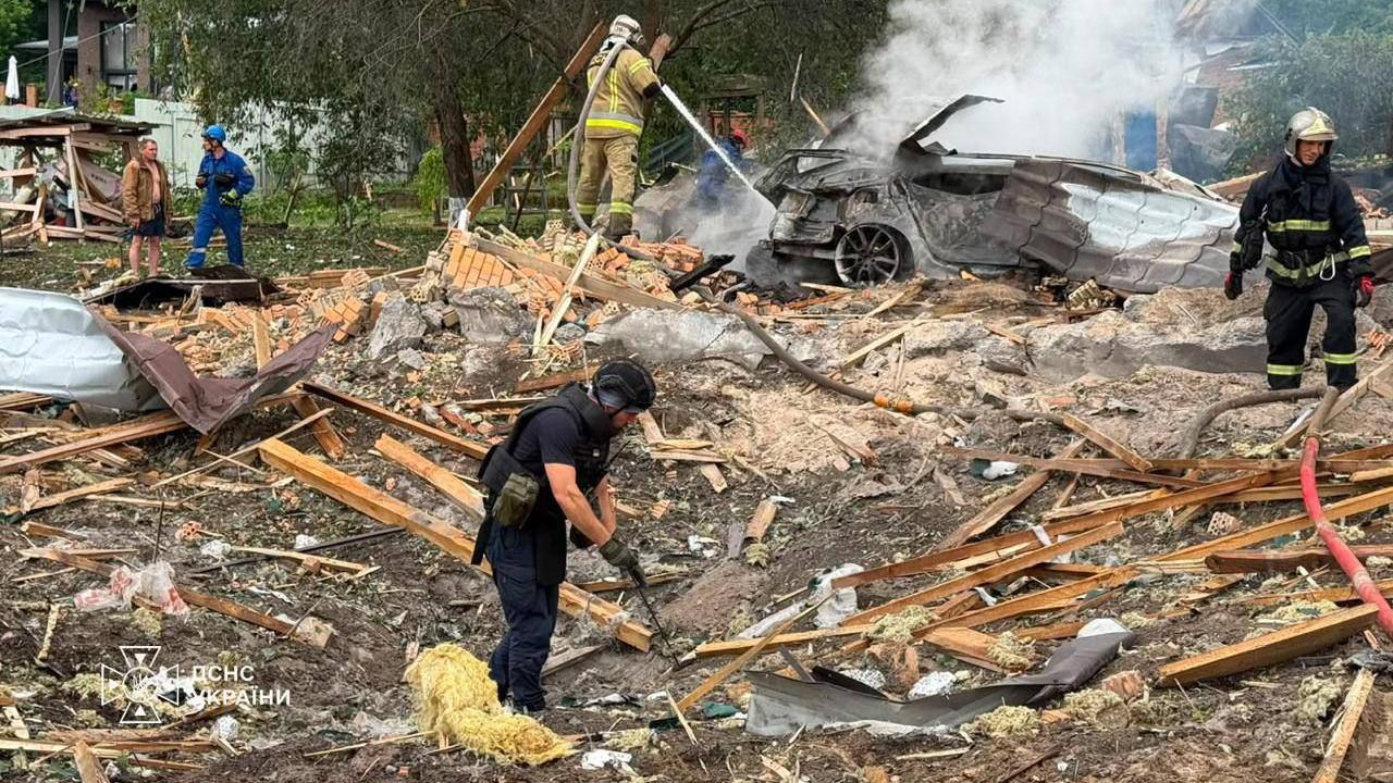 Emergency services clear through the rubble following a Russian missile strike just outside of Kyiv