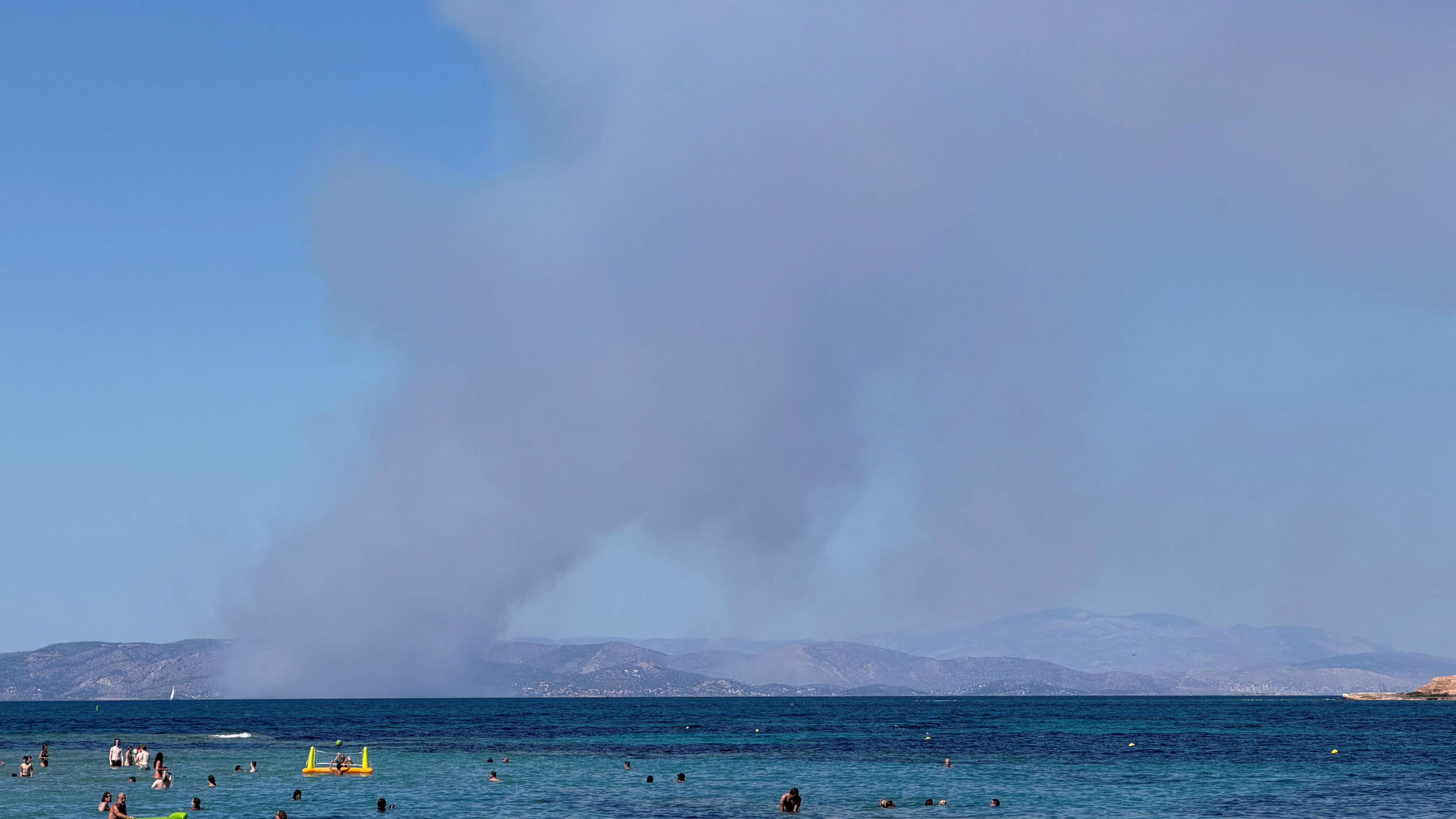 Two dead and evacuation in progress as twin fires blaze on Greek island