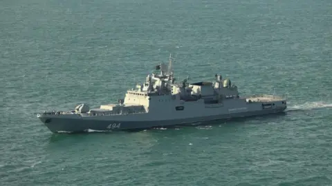 Russian frigate fires warning shots at UK yacht in Channel