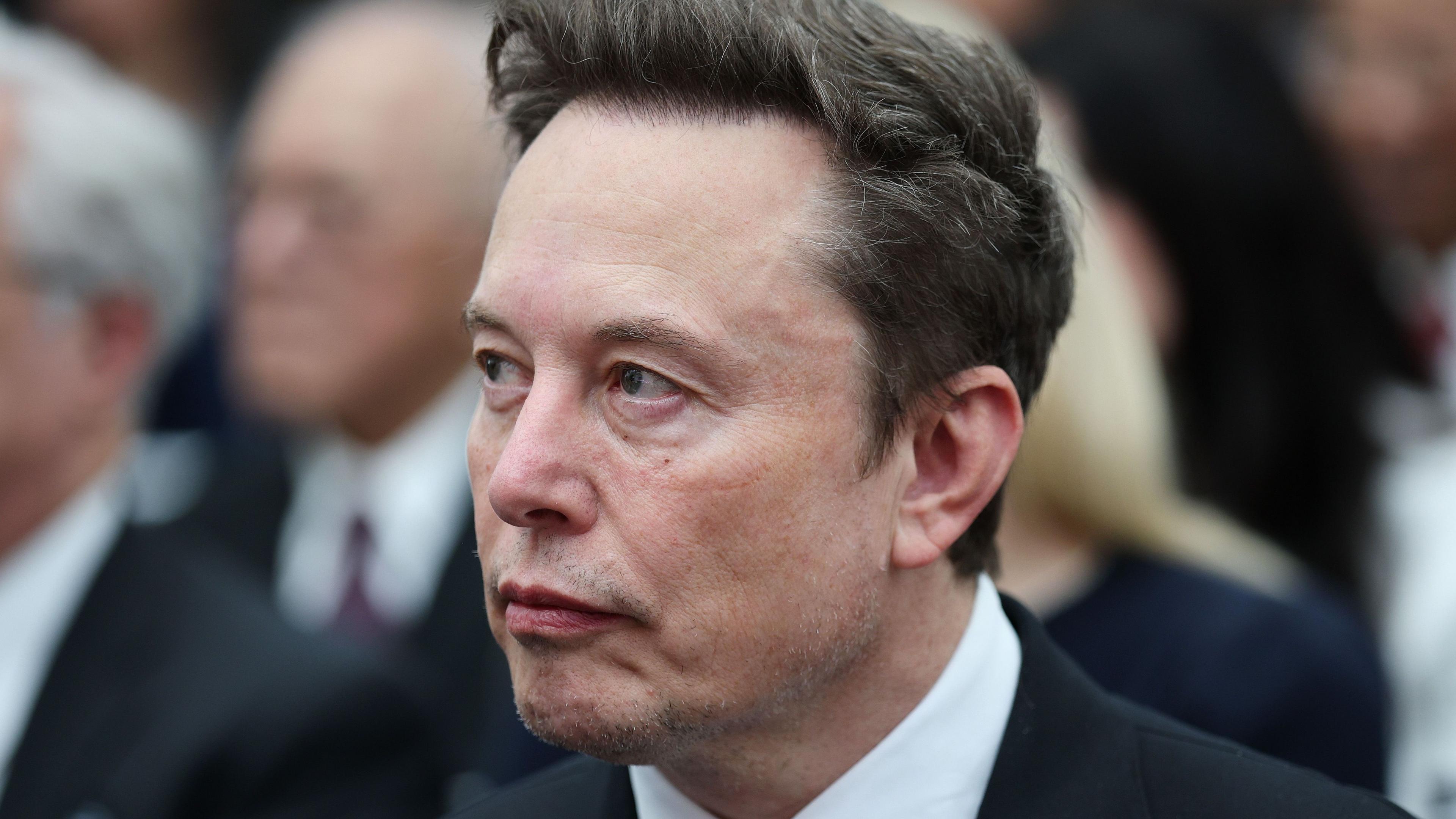 Elon Musk with Starlink equipment
