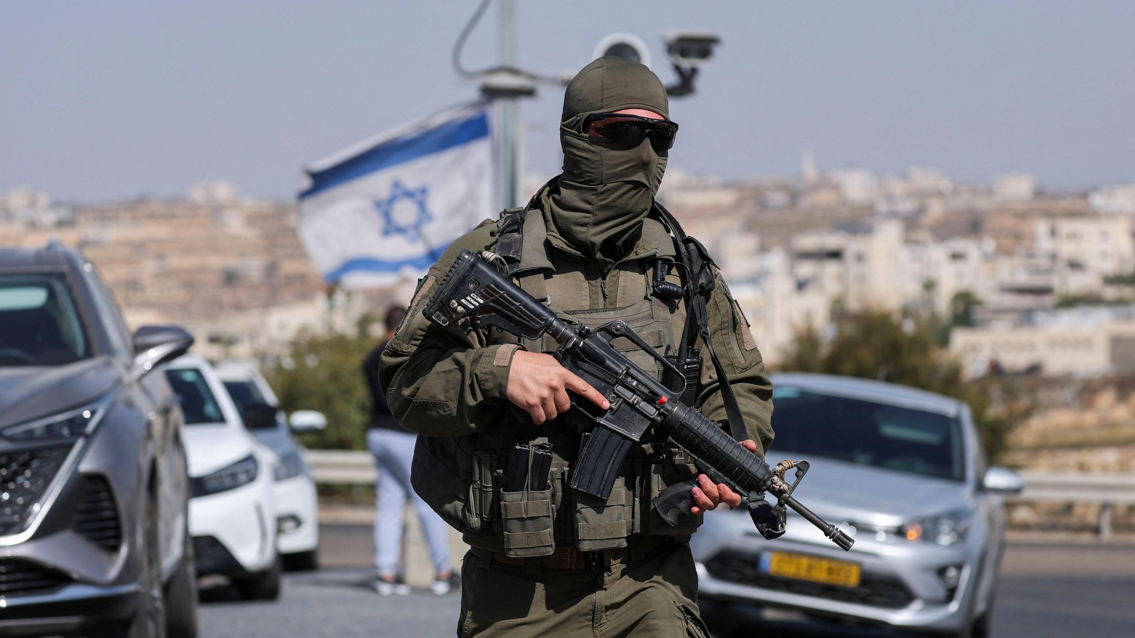 Masked Israeli soldier at Hebron checkpoint
