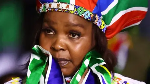 African fans mock South Africa after 2‑0 defeat, spotlighting xenophobia