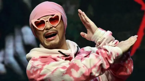 Controversial Rapper Namewee Detained Over Influencer's Mysterious Death