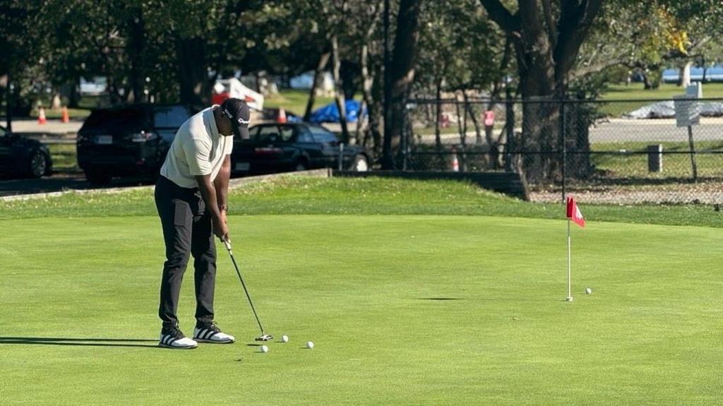 A golfer at East Potomac Golf Links