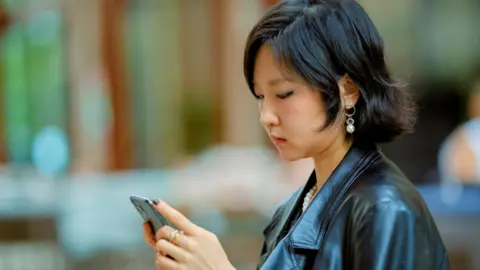 The Rise of 'Are You Dead?': A Vital App for Young People Living Alone in China