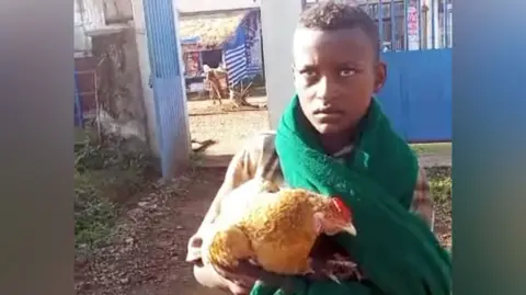 12‑Year‑Old Ethiopian Boy Saves Sick Chicken, Goes Viral