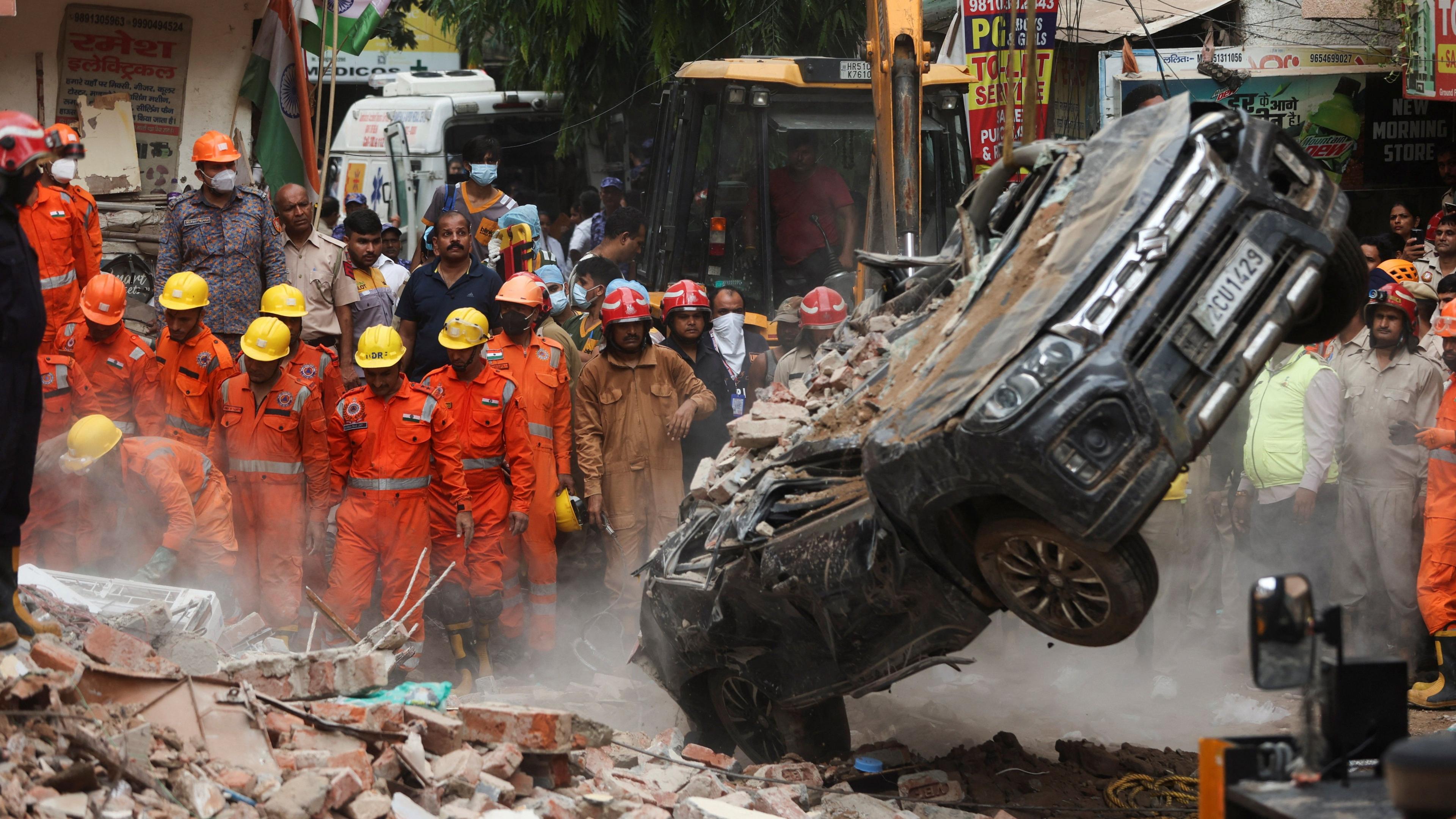 Dozens feared trapped after Delhi building collapse