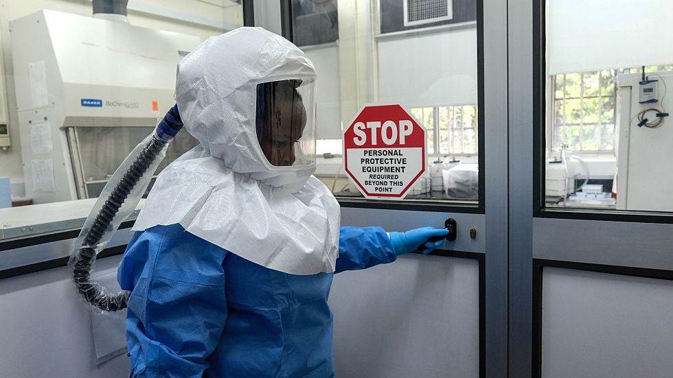 Lab technologist entering Ebola lab