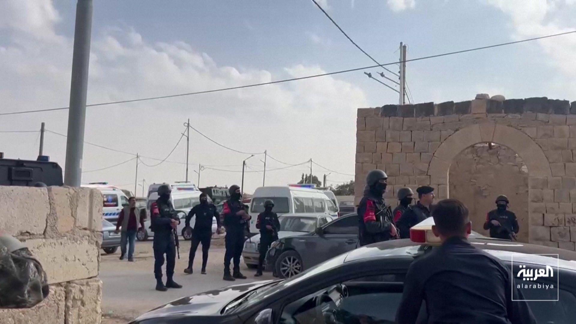 Security personnel surround cars in Jordan after the church shooting