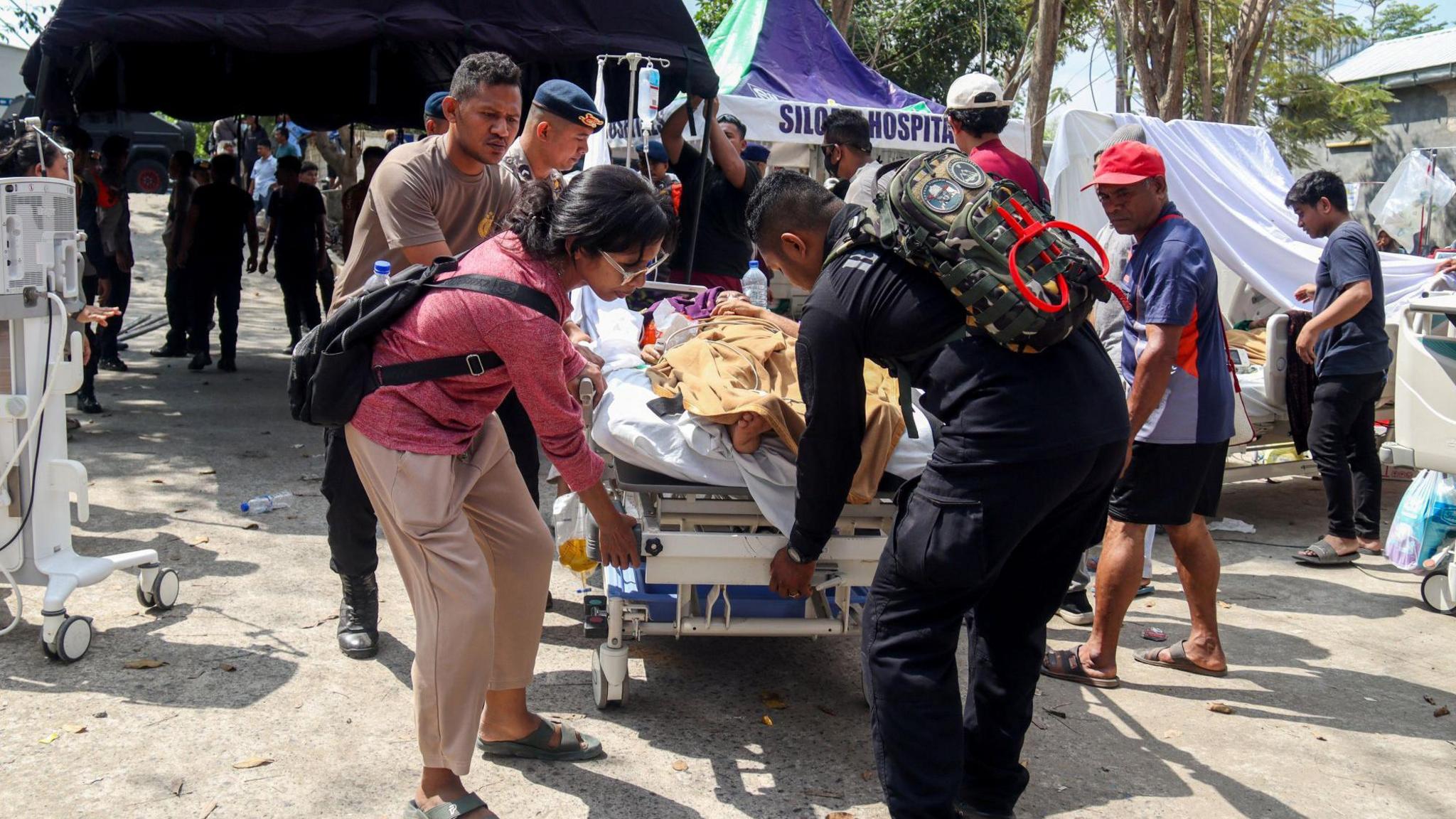 Rescue Crews Hunt Survivors After Powerful 7.7 Earthquake Hits Indonesia's Flores